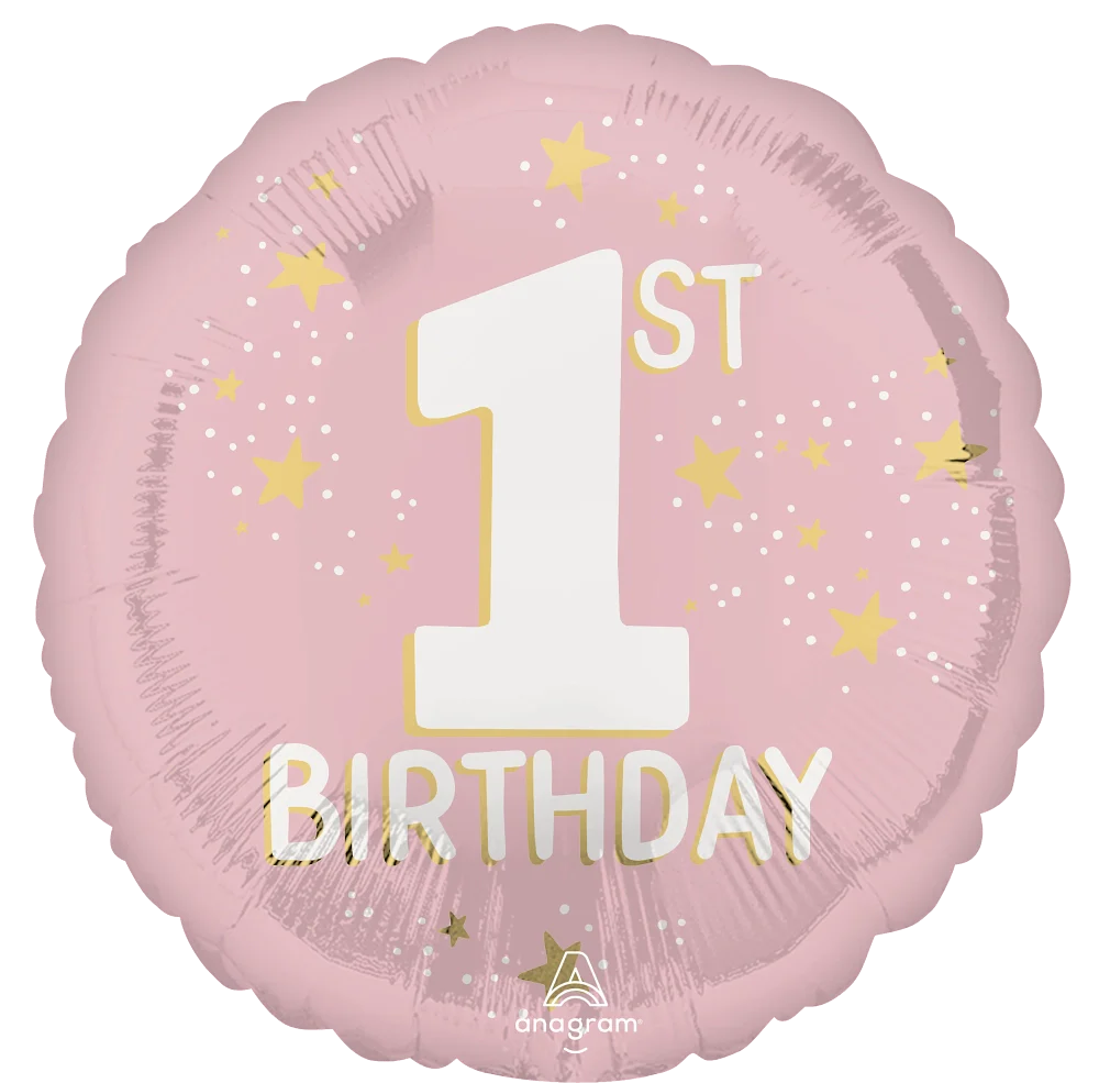 Pink round foil balloon with large white number 1, "ST" in smaller cream letters, surrounded by yellow stars and confetti.