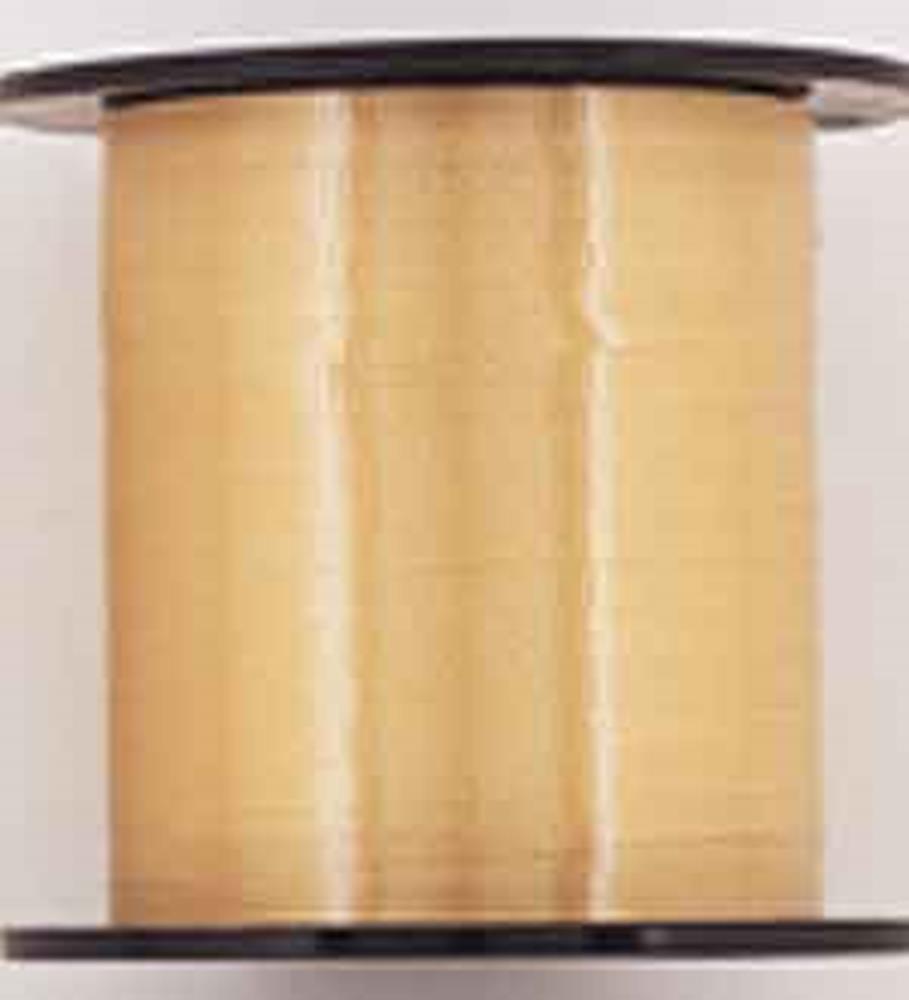 Roll of shiny gold curling ribbon on a black spool, smooth and narrow plastic material.