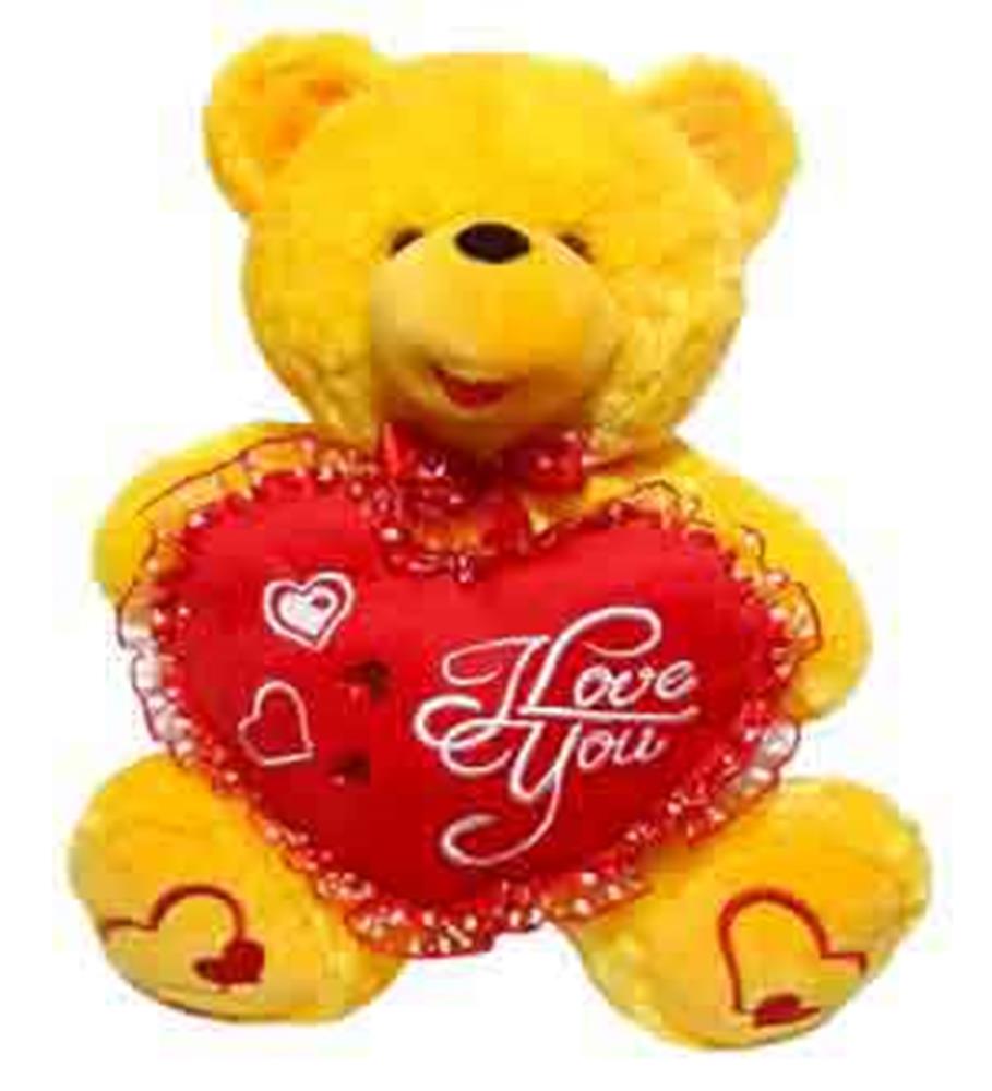 Bright yellow plush teddy bear holding a red heart pillow with "I Love You" and decorative lights.