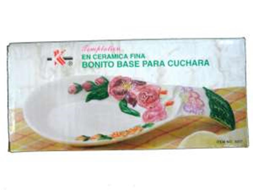 White ceramic spoonrest with pink rose and green leaf floral design.