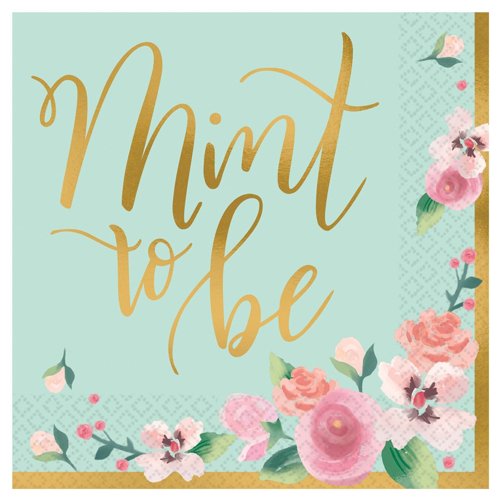 Square pastel mint green napkin with gold cursive "Mint to Be" text and pink floral accents in corners.