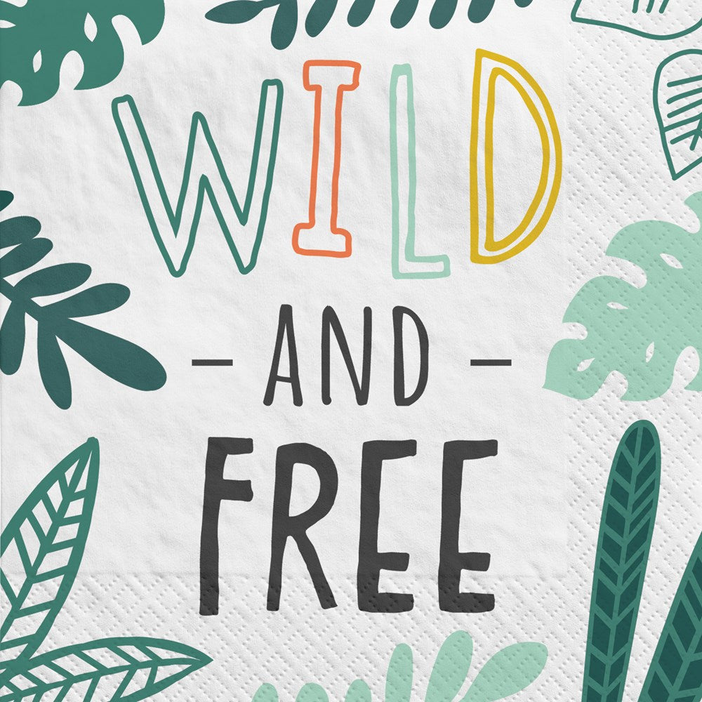 White beverage napkin with green tropical leaves and colorful "Wild and Free" text in playful fonts.