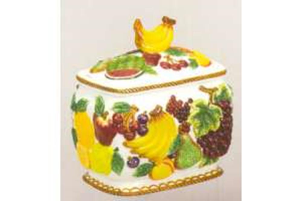 Ceramic cookie jar with colorful fruit designs and a yellow bird-shaped lid handle.