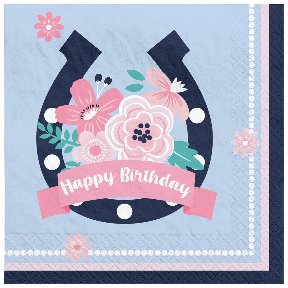 Light blue beverage napkin with navy horseshoe, pink and white flowers, and "Happy Birthday" pink banner.