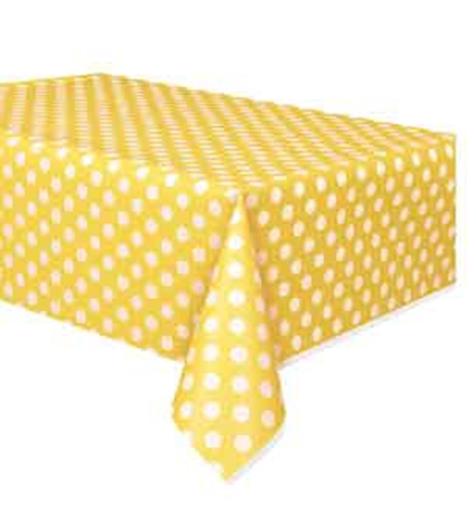 Yellow tablecloth with white polka dots, rectangular shape, smooth fabric drape.