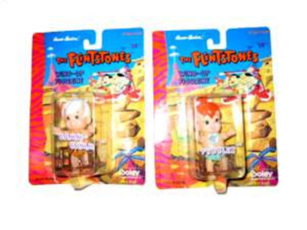 Two Flintstones-themed baby walker toys in plastic packaging, featuring colorful cartoon backgrounds and small baby.