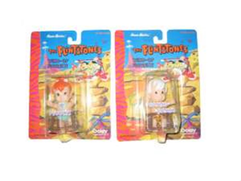 Two Flintstones mini figurines in colorful blister packaging with cartoon background and character names visible.