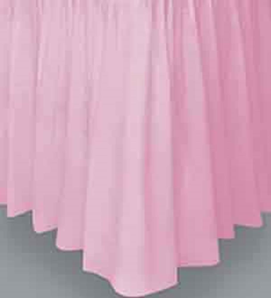 Light pink fabric tableskirt with gathered, pleated design and scalloped bottom edge.