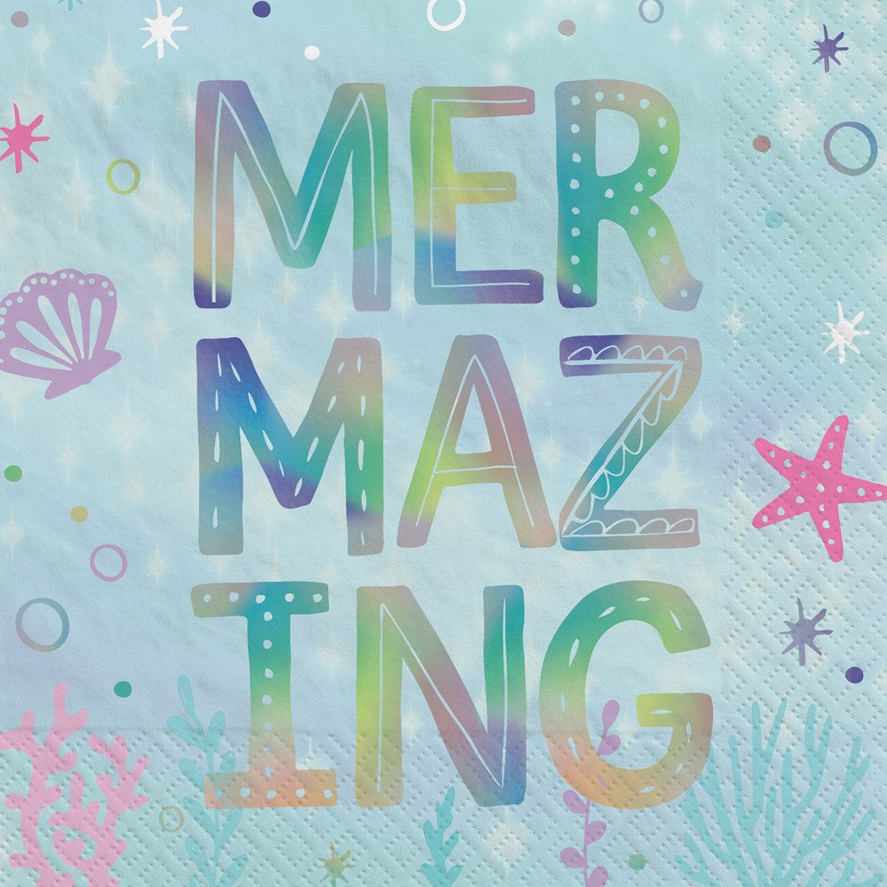 Light blue square napkin with colorful "MERMAZING" holographic letters and sea-themed icons like starfish and shells.