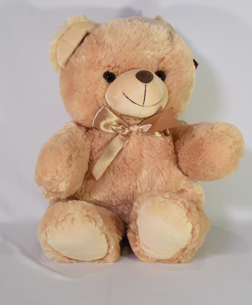 Light brown plush teddy bear with cream-colored snout, paws, and inner ears, wearing a satin bow.