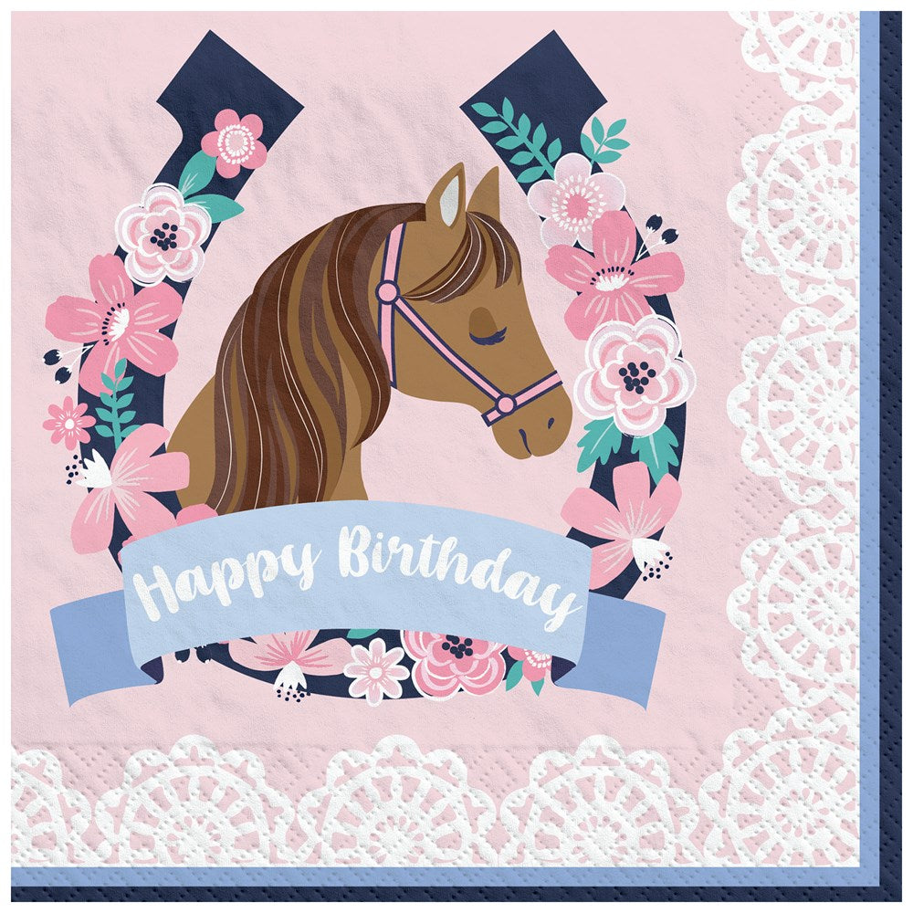 Pink square luncheon napkin with a brown horse head inside a navy horseshoe decorated with pink flowers and green leaves,.