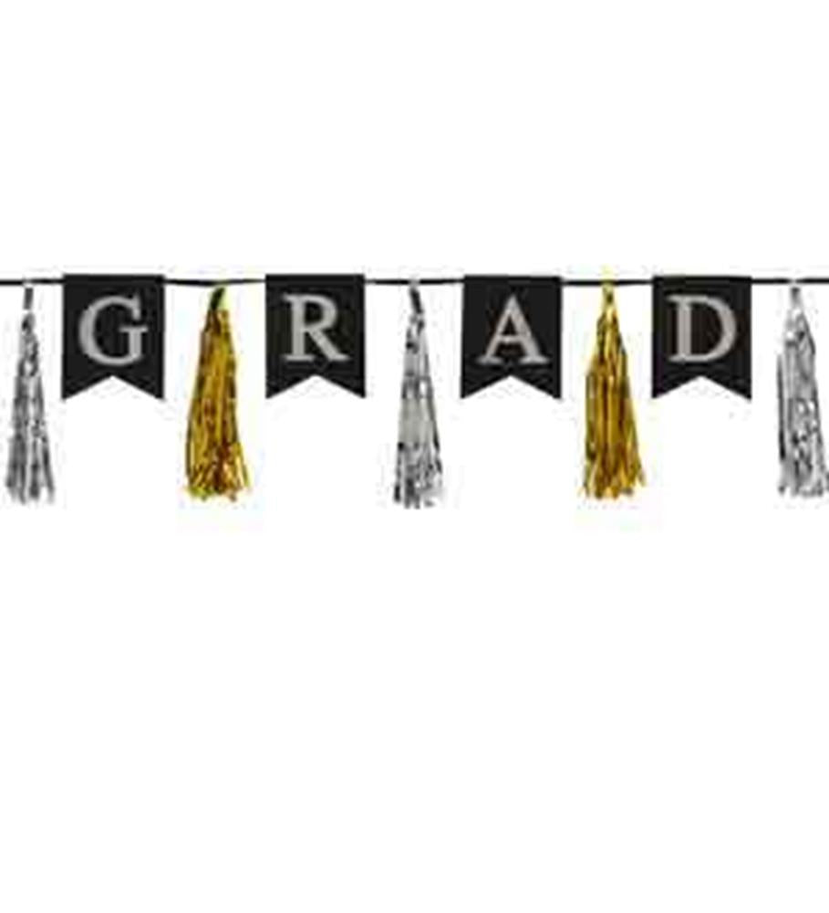 Black pennant flags with white letters spelling "GRAD" alternating with silver and gold metallic tassels hanging on a black.