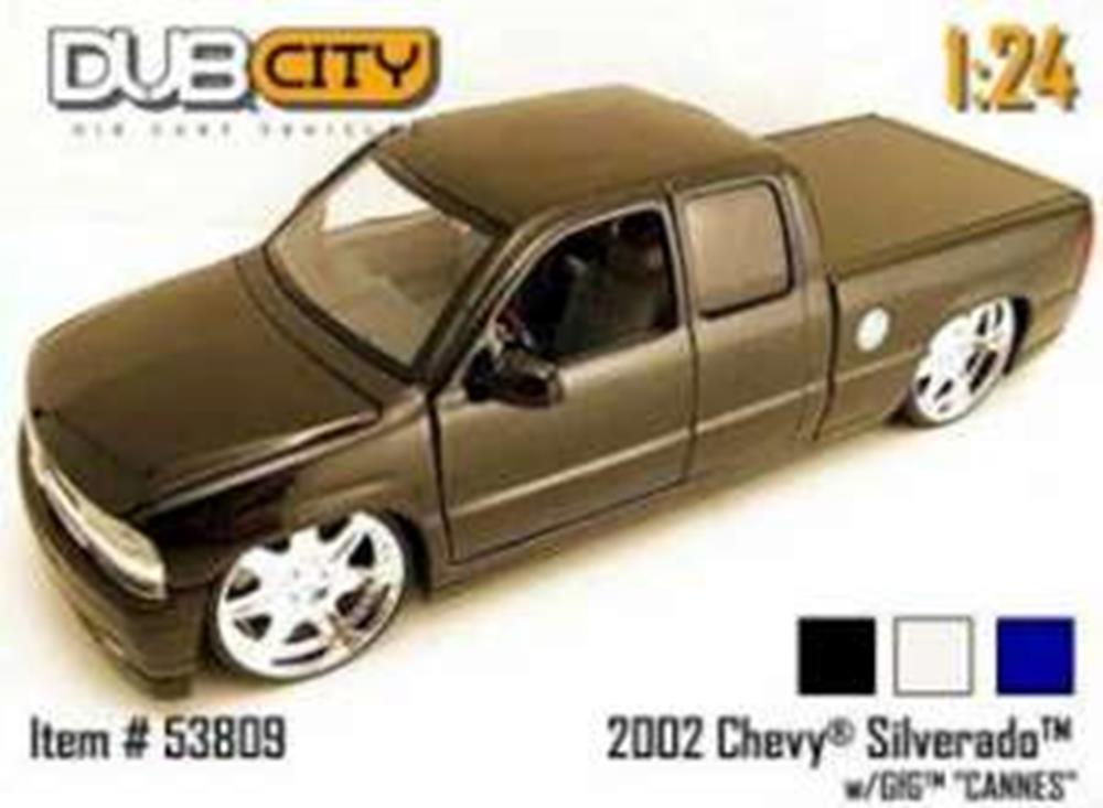 24 scale 2002 Chevy Silverado model truck with large chrome wheels and extended cab.