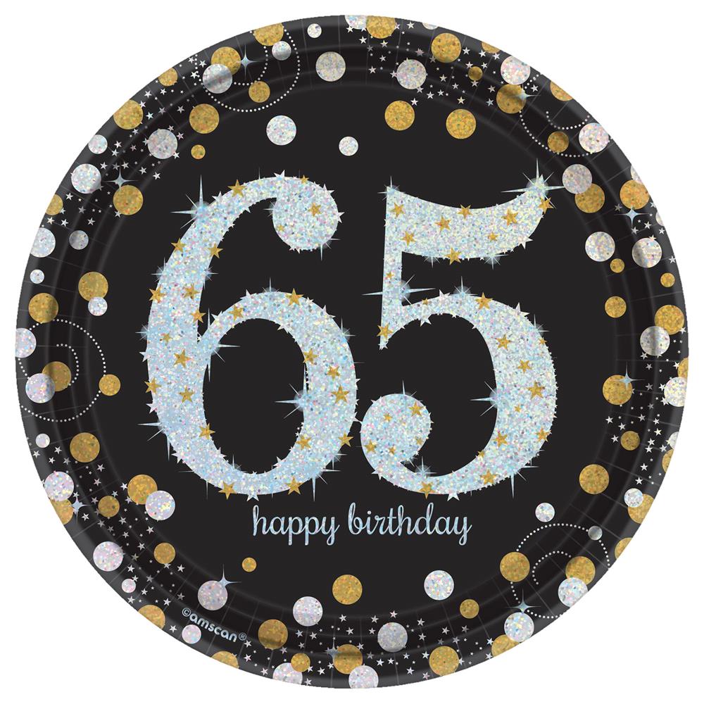 Black round plate with large glittering "65" and "happy birthday" text surrounded by gold, silver, and white confetti dots.