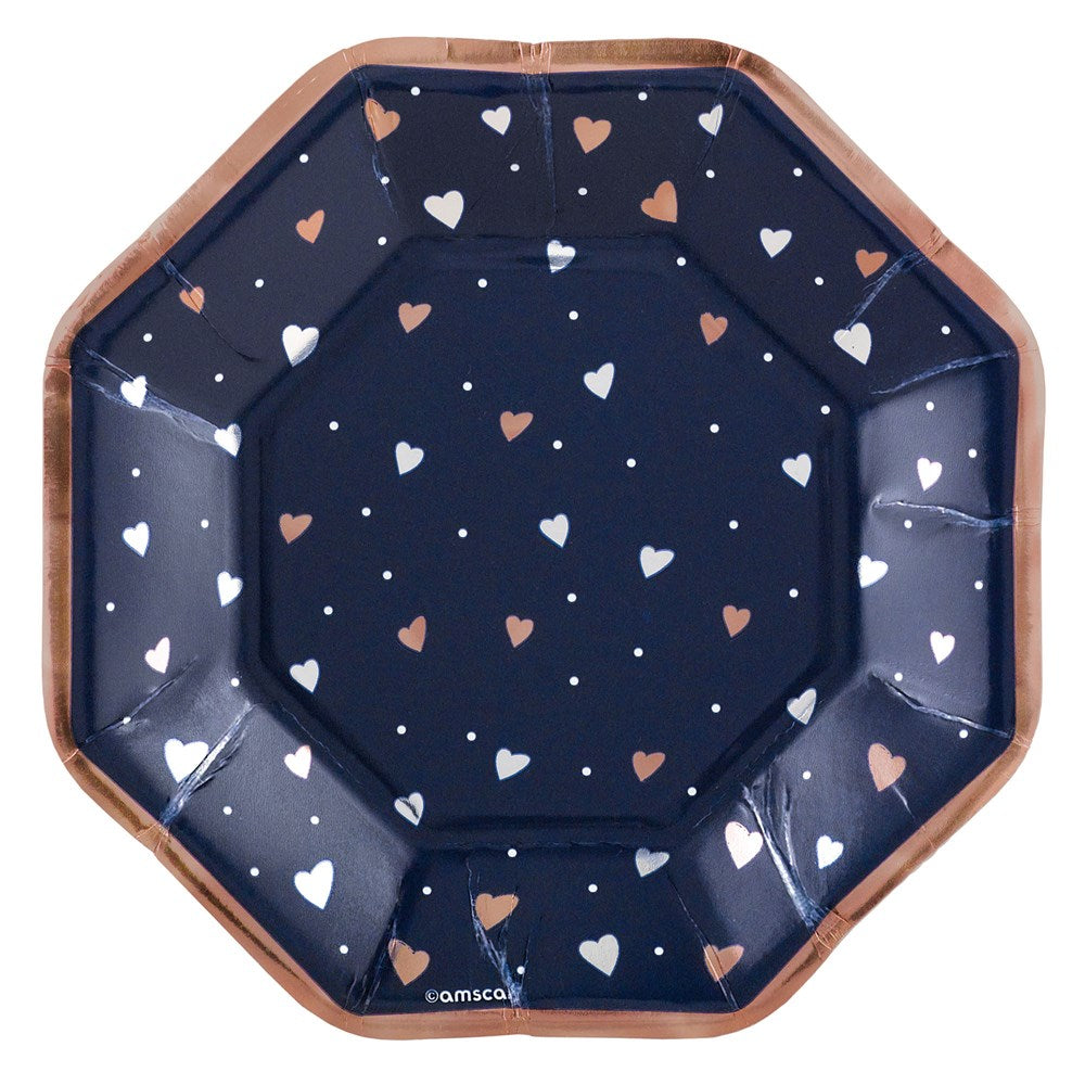 Navy blue octagonal plate with metallic rose gold edges and scattered white and rose gold hearts, 7-inch size.