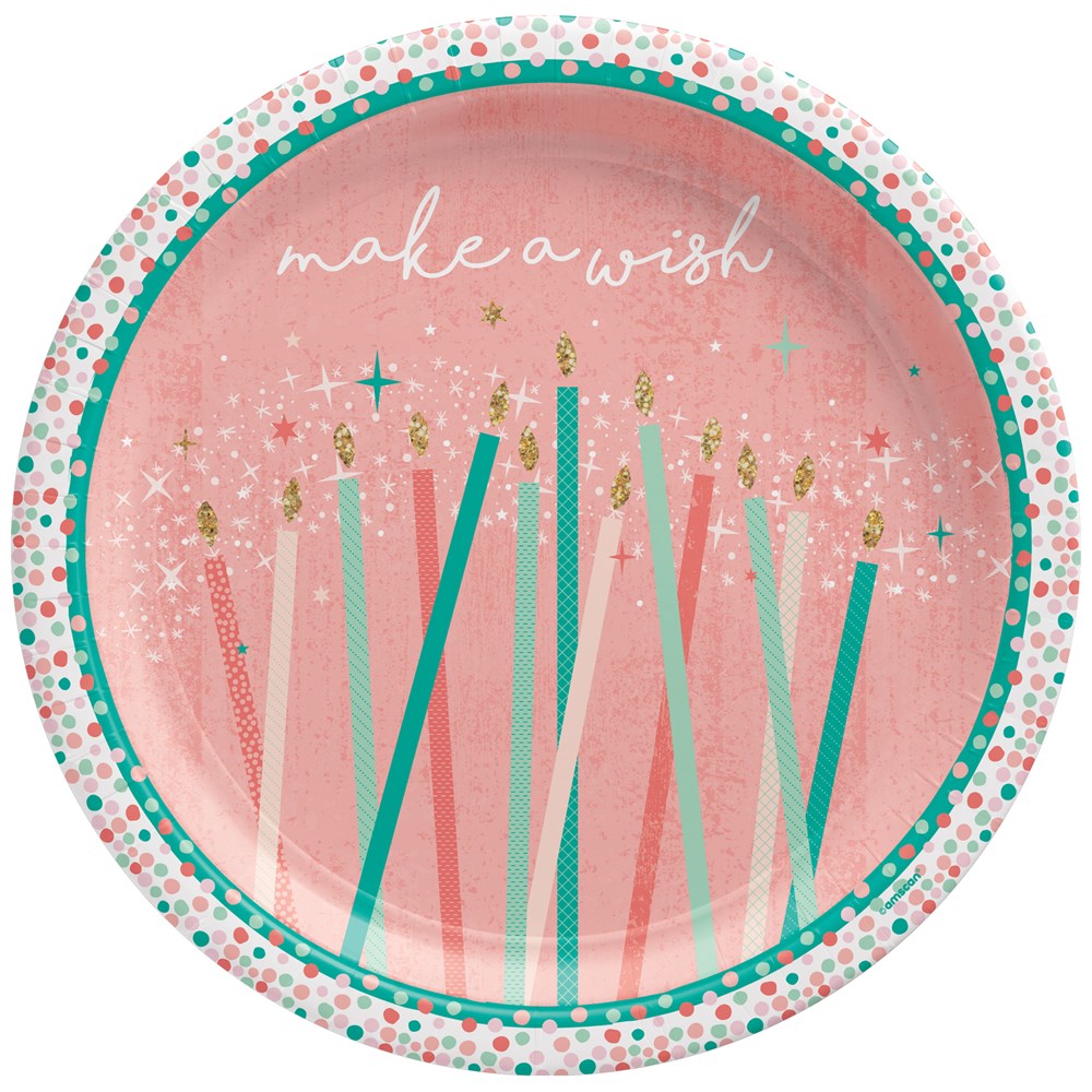 Round 7-inch pink paper plate with teal and white polka dot border, candles graphic, and "make a wish" text in white cursive.