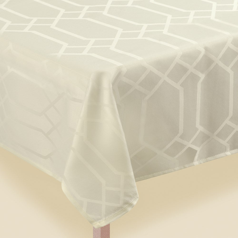 Cream fabric tablecover with a geometric gate pattern in a 60 by 104-inch rectangular size.