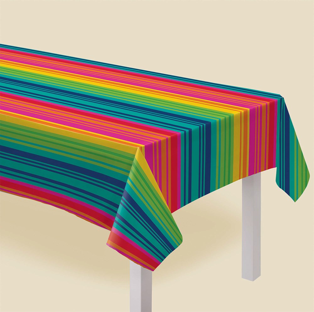 Colorful serape stripe vinyl tablecover with flannel backing on rectangular table.