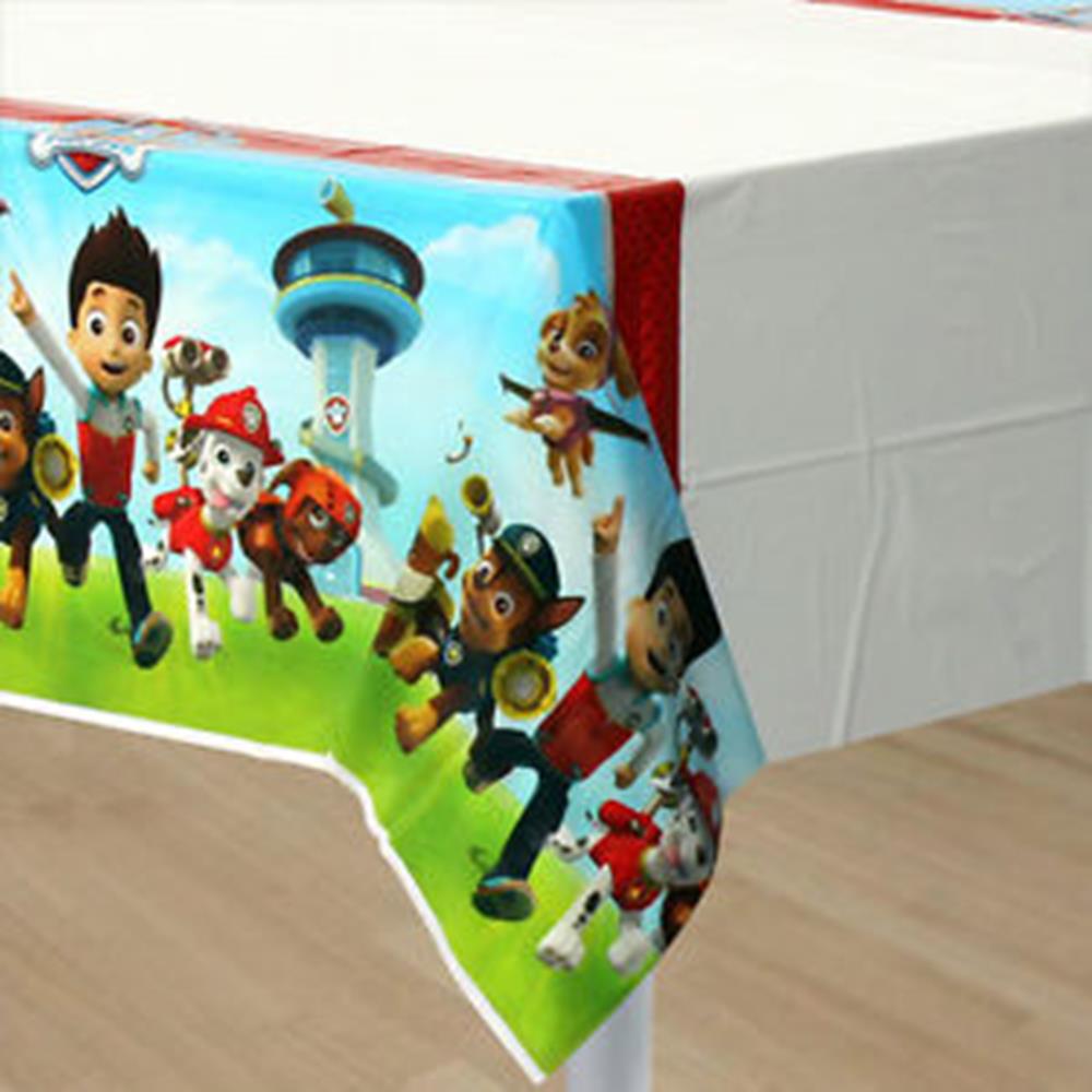 Rectangular white tablecover with colorful Paw Patrol characters and lookout tower along edges.