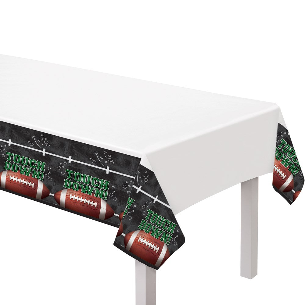 White plastic table cover with black sides featuring footballs, goalposts, and green "Touchdown" text.