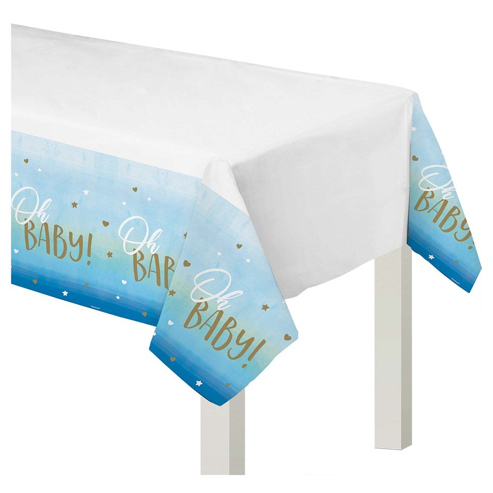 Rectangular plastic table cover with white center and blue borders, gold foil "Oh Baby!" text and confetti dots for baby.
