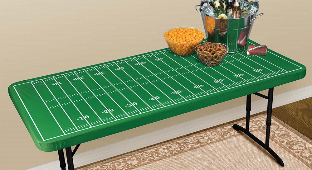 Green rectangular table cover printed with white football field lines and numbers, elastic edge fitting a 72x36 inch table.