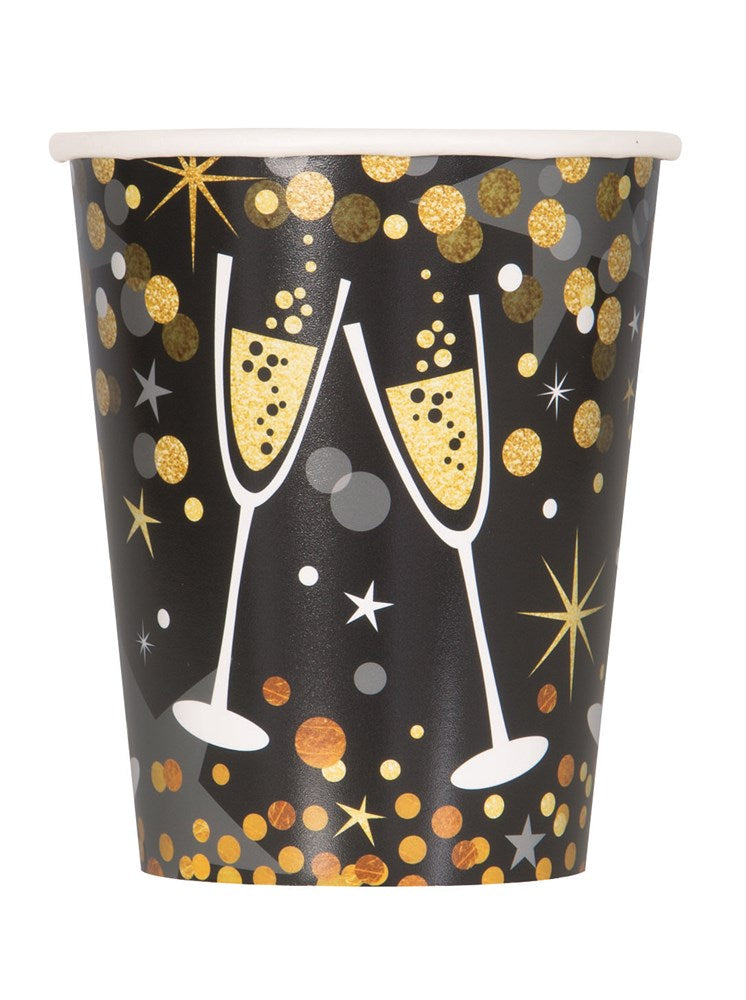 Black paper cup with gold and silver glitter dots, stars, and two white champagne glasses clinking, 9oz.