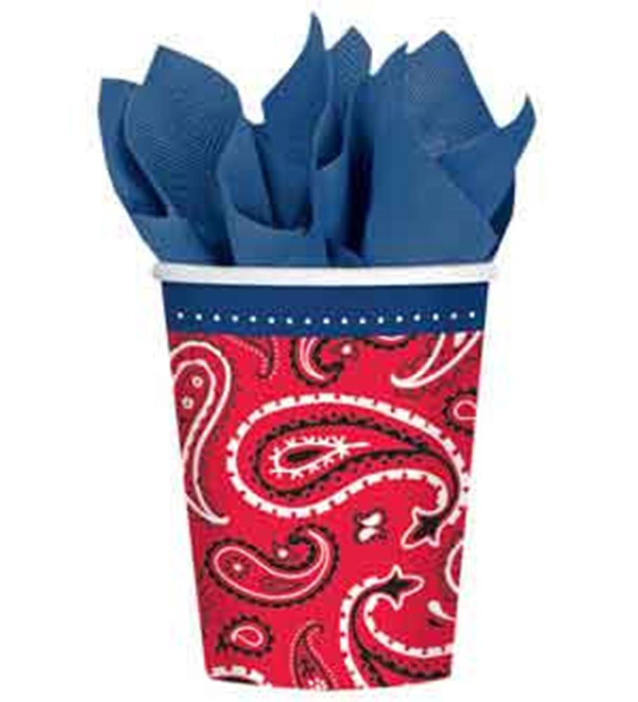 Red cup with white paisley bandana pattern and blue napkins inside.