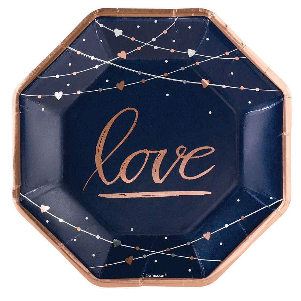 Navy octagonal plate with metallic rose gold "love" script and heart and dot string accents.