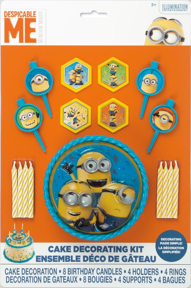 Despicable Me cake decorating kit with four character rings, six hexagonal toppers, six candles, and blue frosting edge.