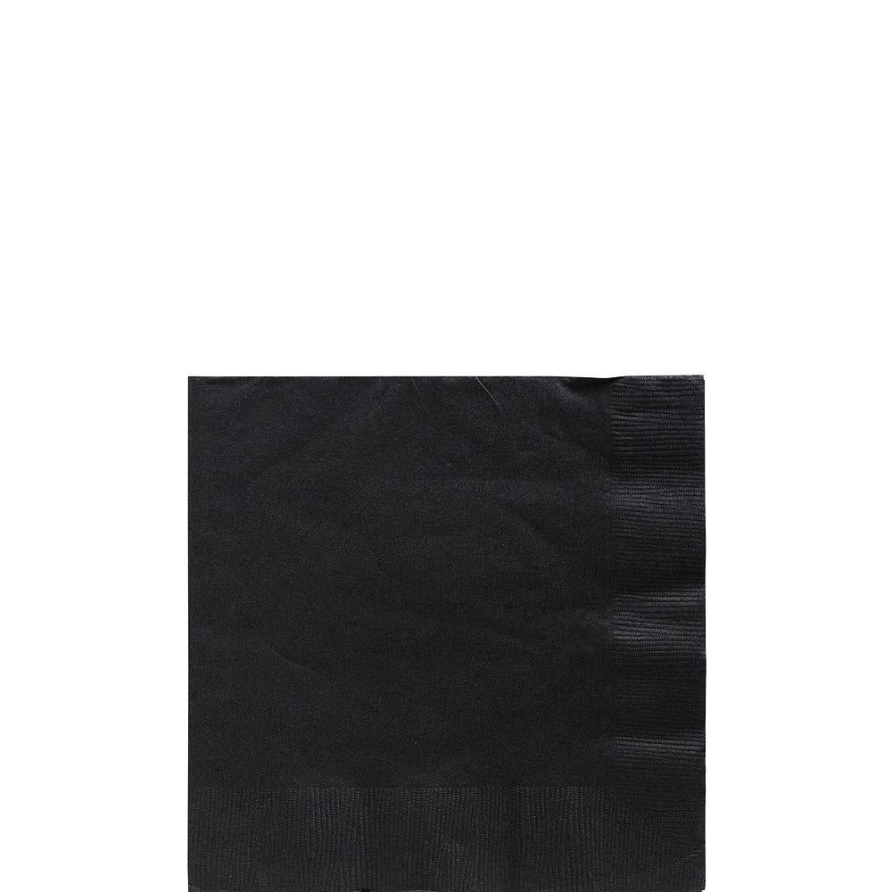 Stack of small black square paper napkins with smooth texture on white background.