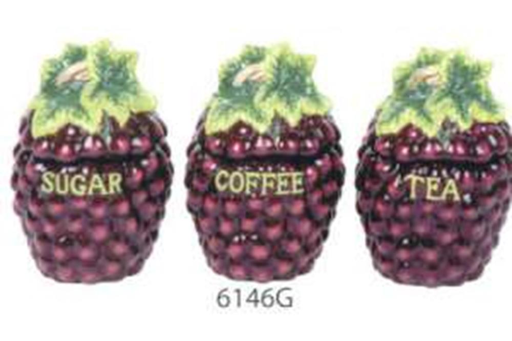 Set of three purple grape-shaped ceramic storage jars with green leaf lids labeled Sugar, Coffee, and Tea.