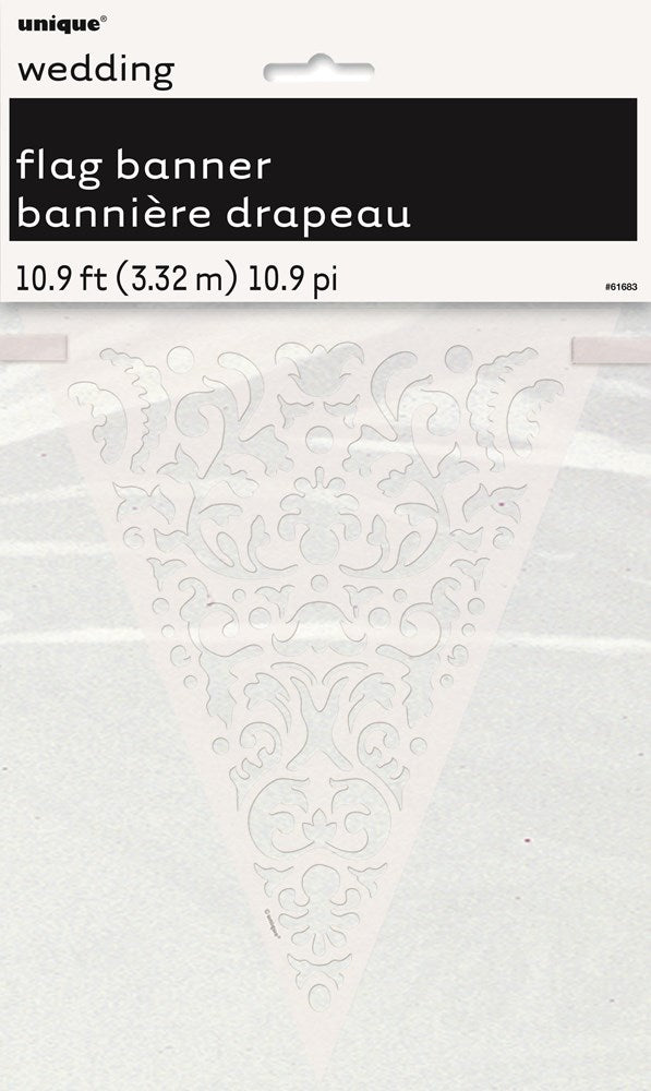 White lace paper flag banner with intricate floral cutout design on triangular flags.