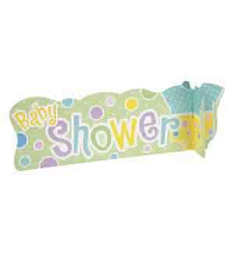 Colorful polka dot 3D centerpiece with baby shower text and blue baby clothes decoration.