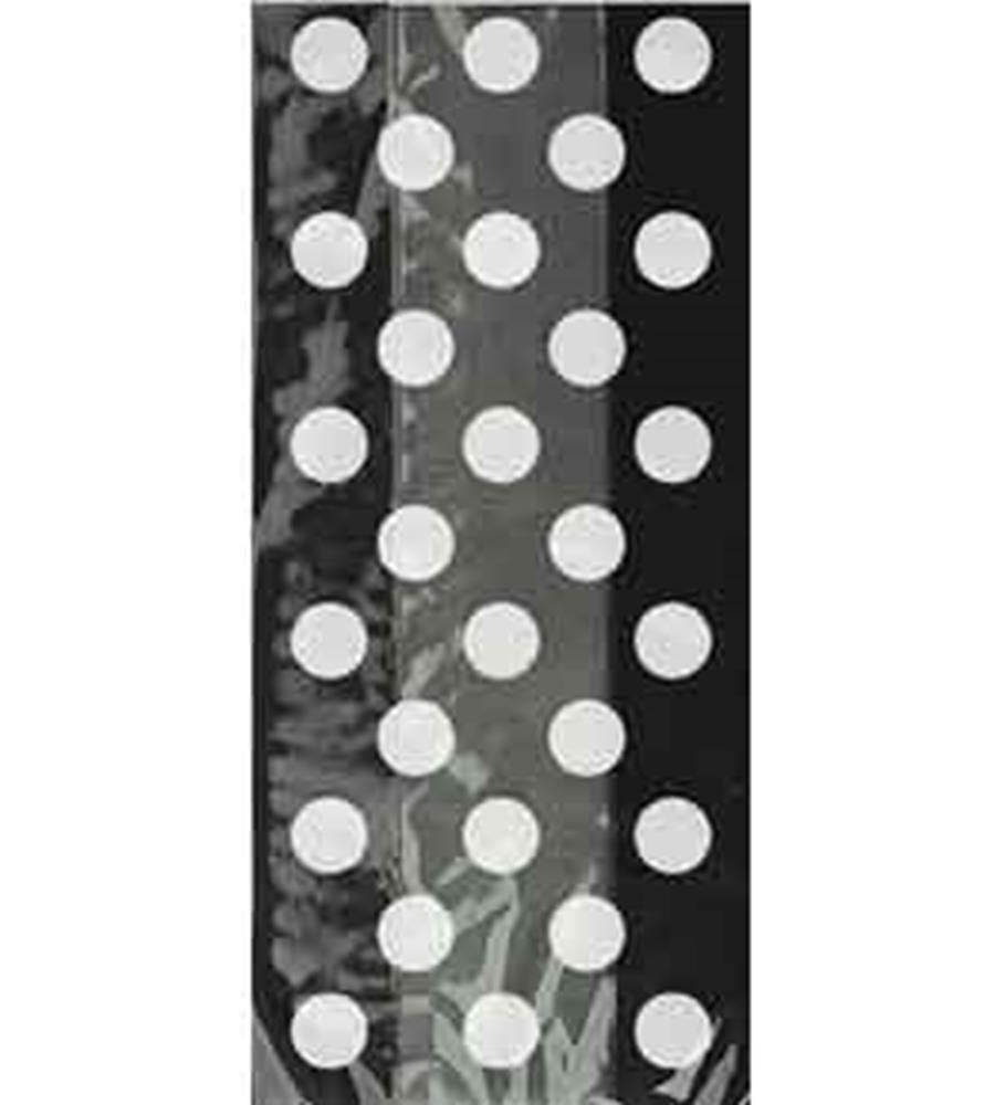 Clear cello bag with black background and evenly spaced large white polka dots.
