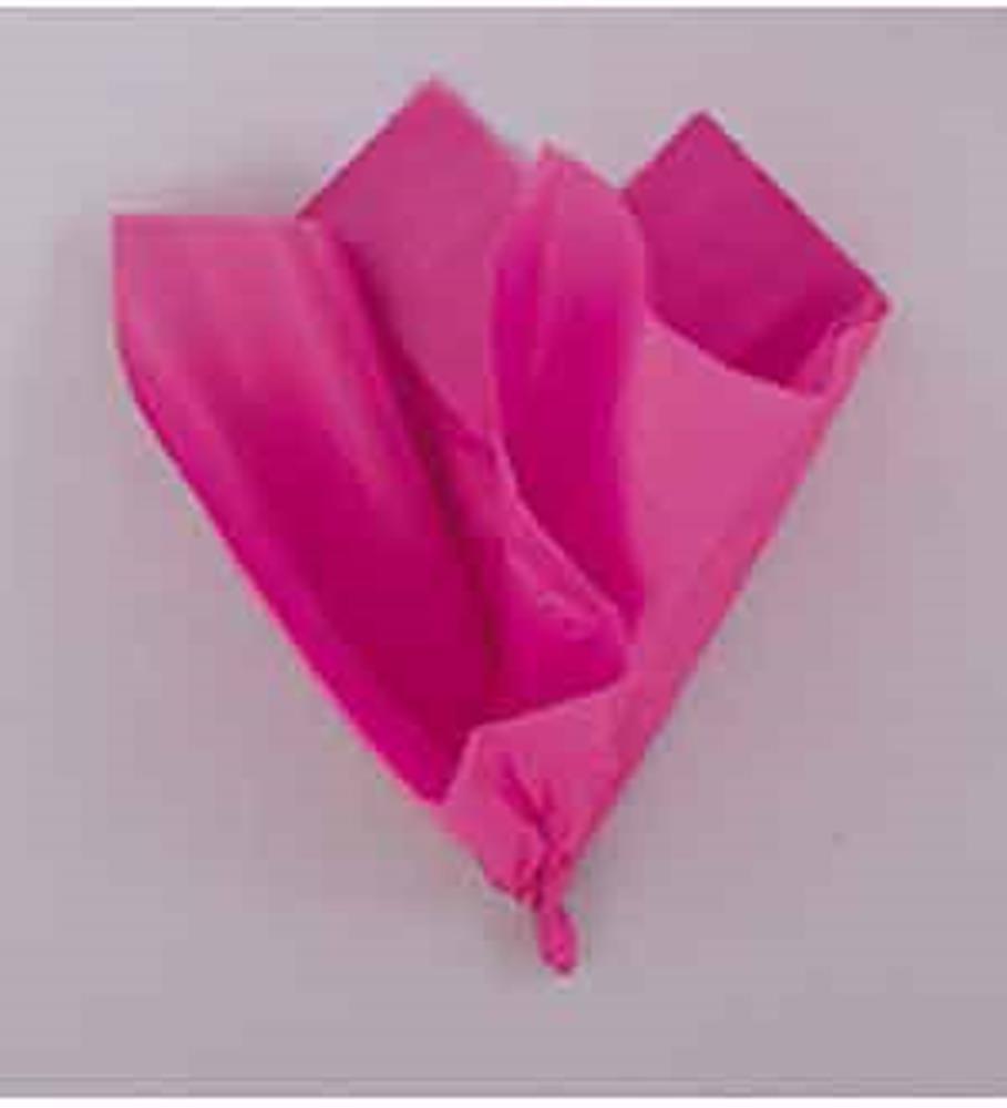 Bright hot pink tissue paper sheet loosely folded on a light surface.
