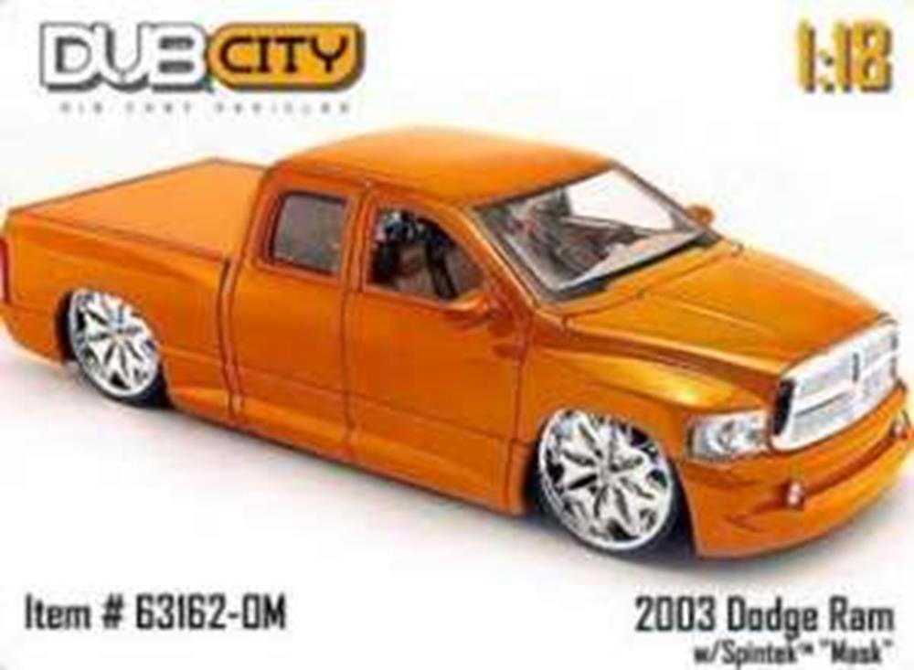 18 scale model of 2003 Dodge Ram with extended cab and silver detailed wheels.