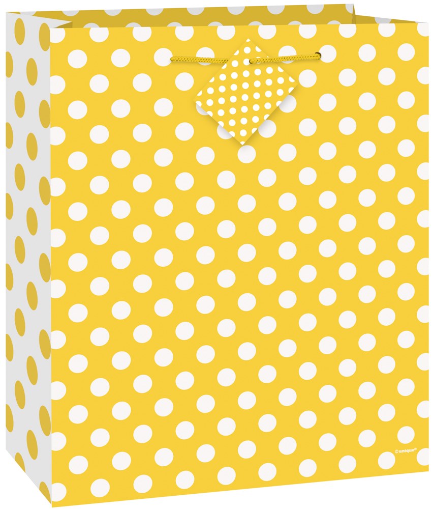 Medium yellow gift bag with white polka dots and matching patterned tab closure.