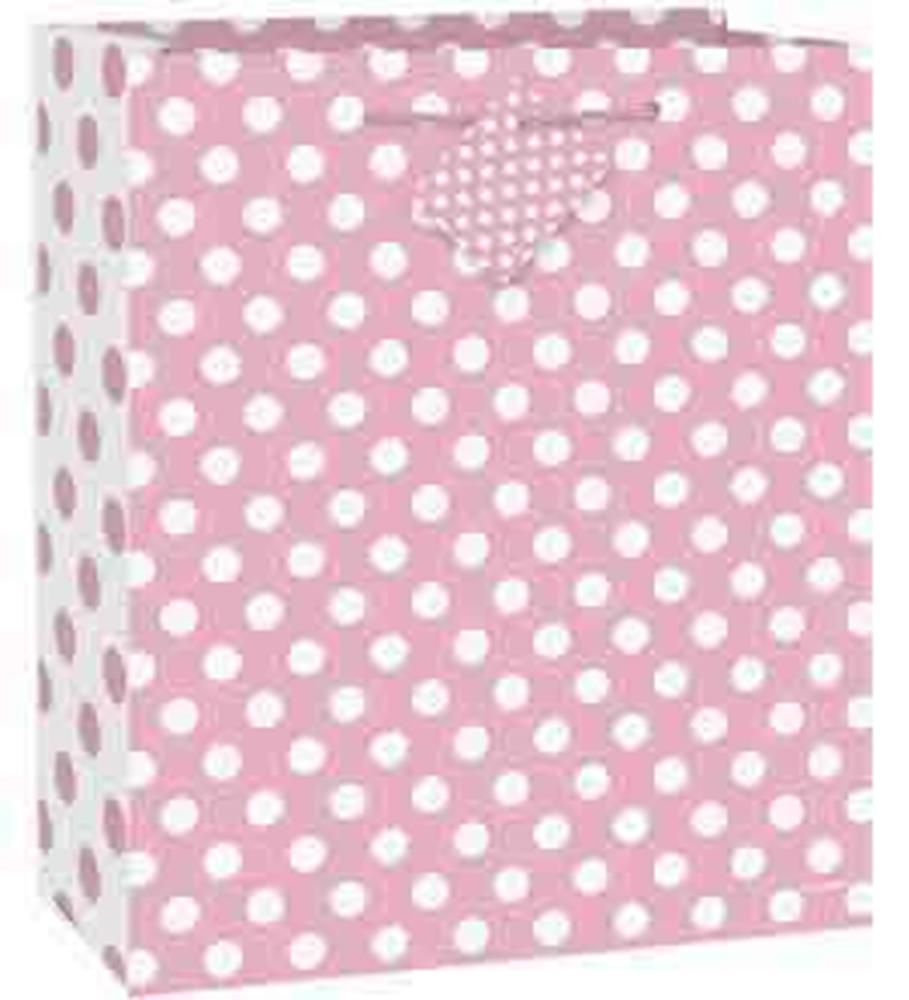 Set of 12 large pink gift bags with white polka dots and scalloped handle cutouts.
