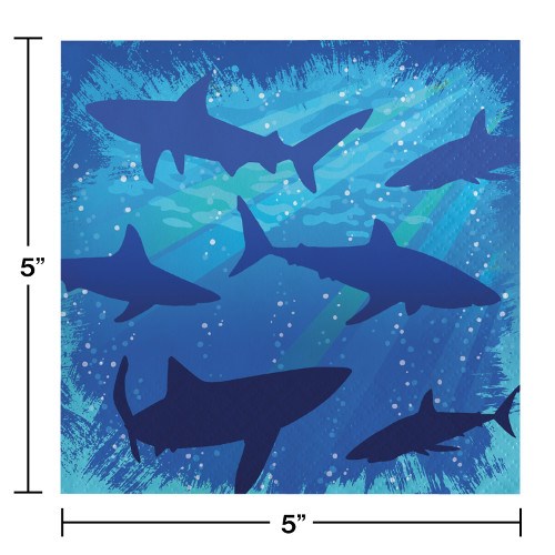 Blue square paper napkins with dark blue shark silhouettes and light blue splash background.