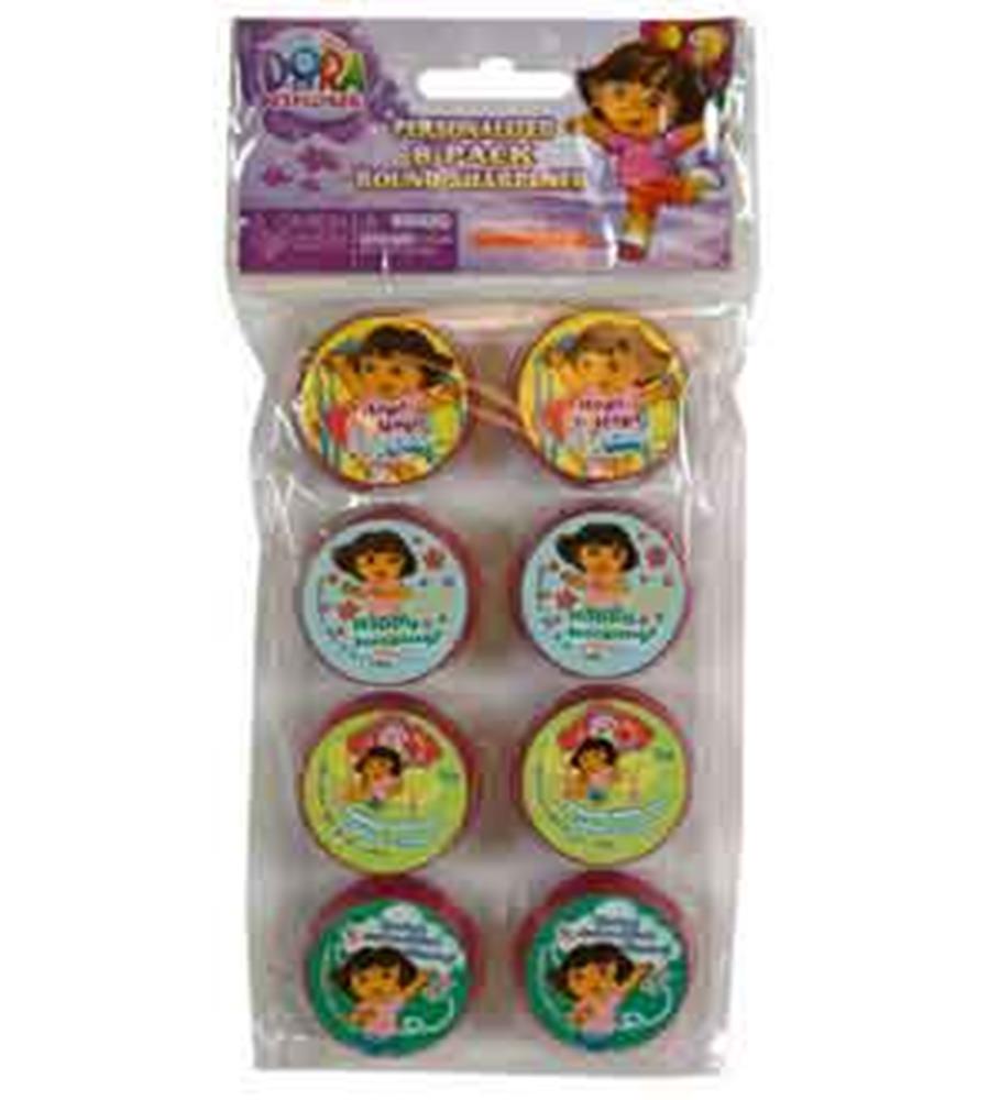 Set of eight round plastic pencil sharpeners featuring colorful Dora the Explorer designs on each top.