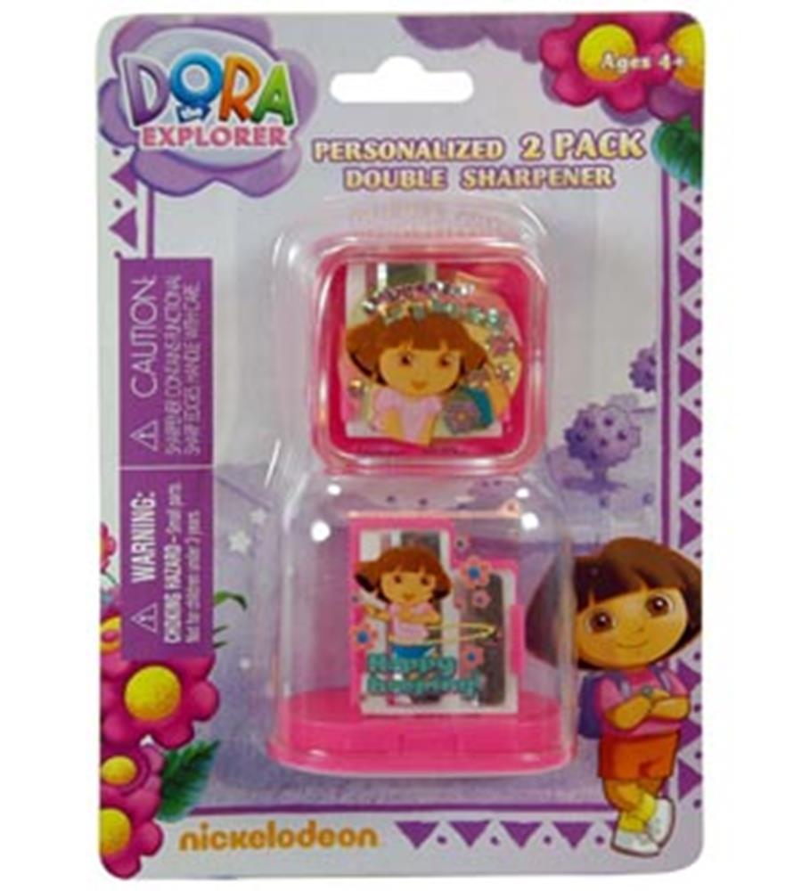 Two pink plastic double pencil sharpeners featuring Dora the Explorer designs in sealed packaging.