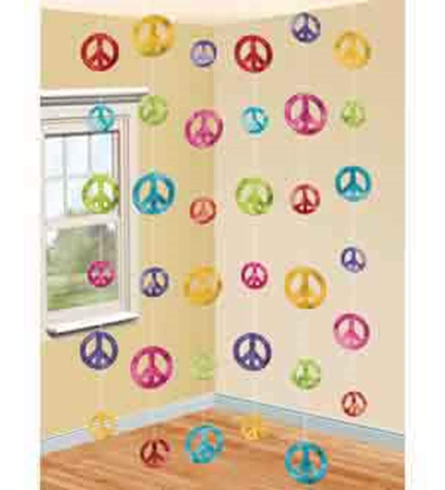Colorful hanging peace sign decorations in red, yellow, pink, blue, green, and purple on clear strings.
