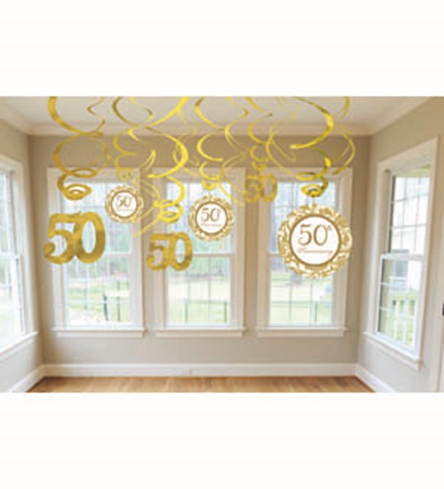 Gold swirl ceiling decorations with hanging cutouts featuring the number 50 and "50th" in an elegant font.