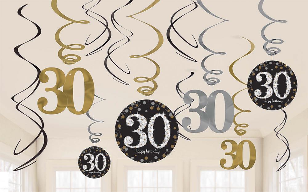 Gold, black, and silver swirled hanging decorations with "30" cutouts and polka dot patterns in a birthday party set.