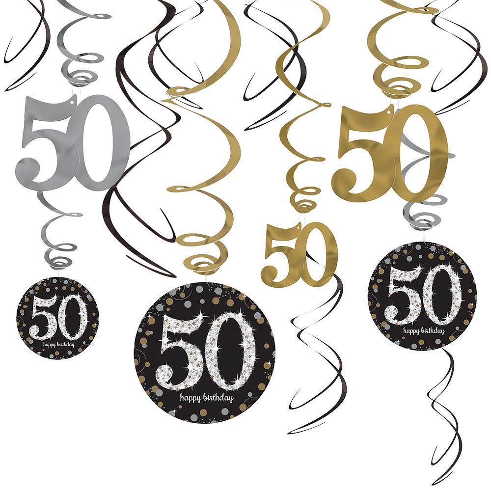 Black, gold, and silver 50-themed swirl decorations with hanging glittery circles and large numbers.