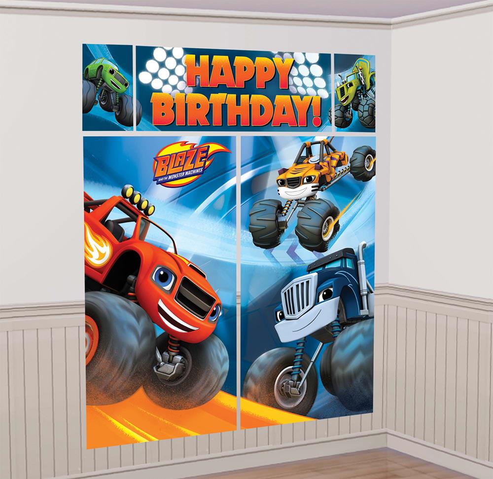 Blaze Monster Machines corner scene setter with monster trucks and "Happy Birthday" text in orange and blue tones.