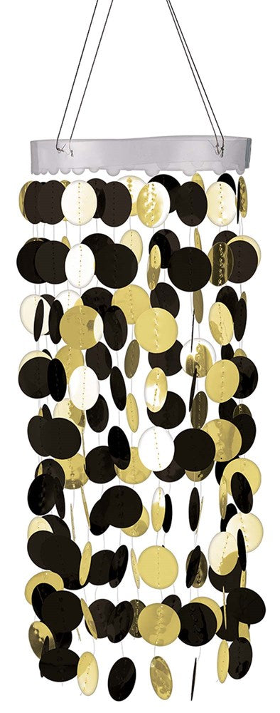Black and gold circular paper decoration hanging from white wooden ring chandelier.