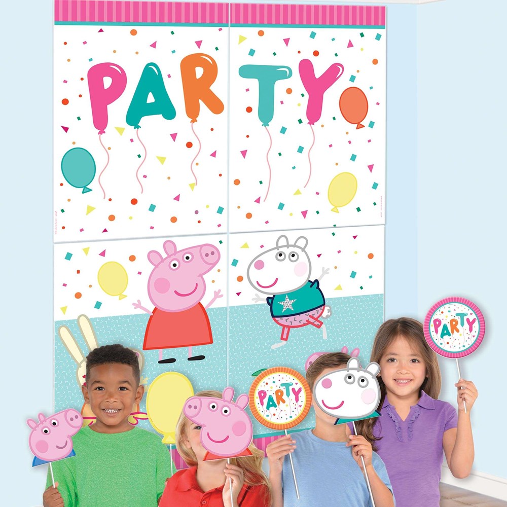 Colorful Peppa Pig confetti-themed party backdrop with cartoon characters and balloon props.
