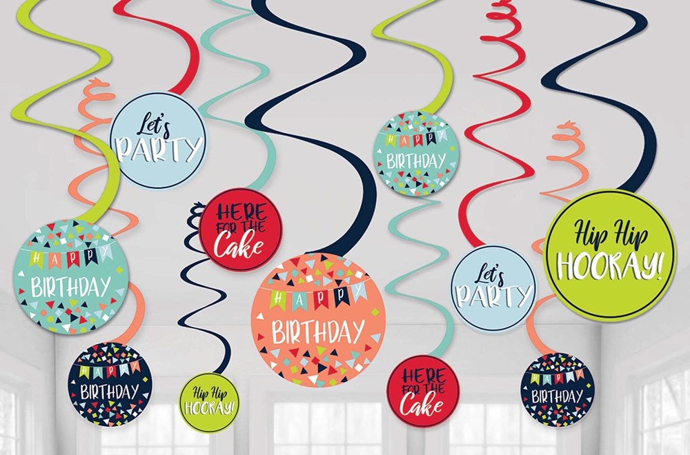 Colorful spiral birthday decorations with round toppers featuring festive birthday messages and patterns.
